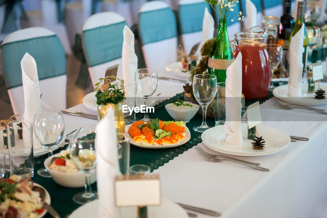 Food and wineglasses on table at restaurant