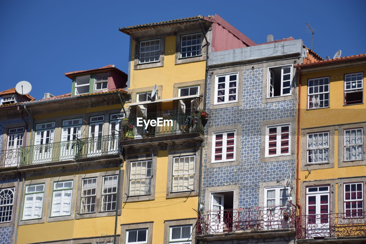 LOW ANGLE VIEW OF RESIDENTIAL BUILDING