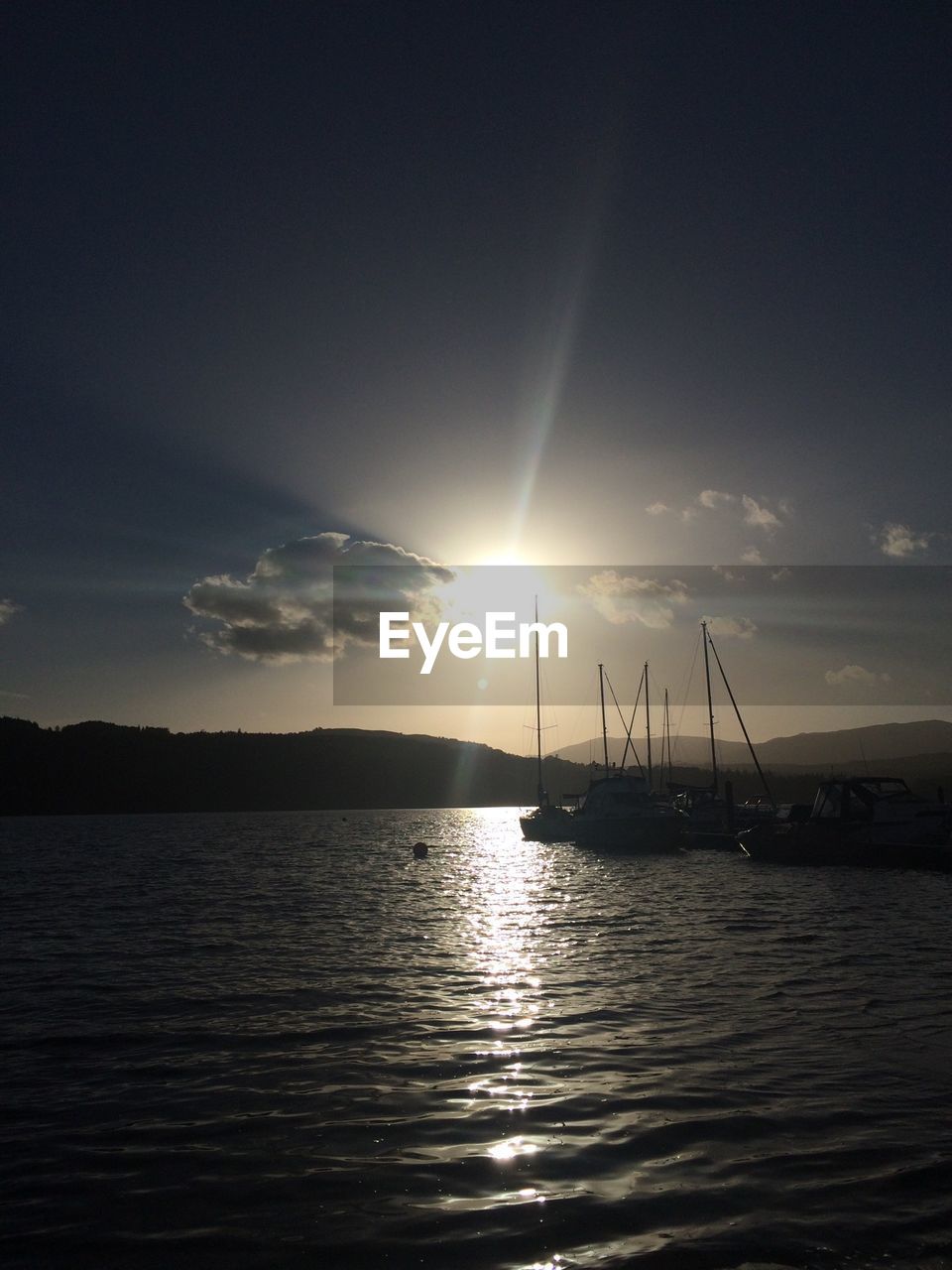 Scenic view of lake at dusk