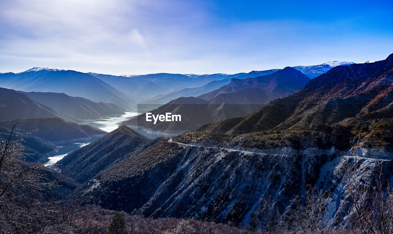 Scenic view of snowcapped mountains against sky