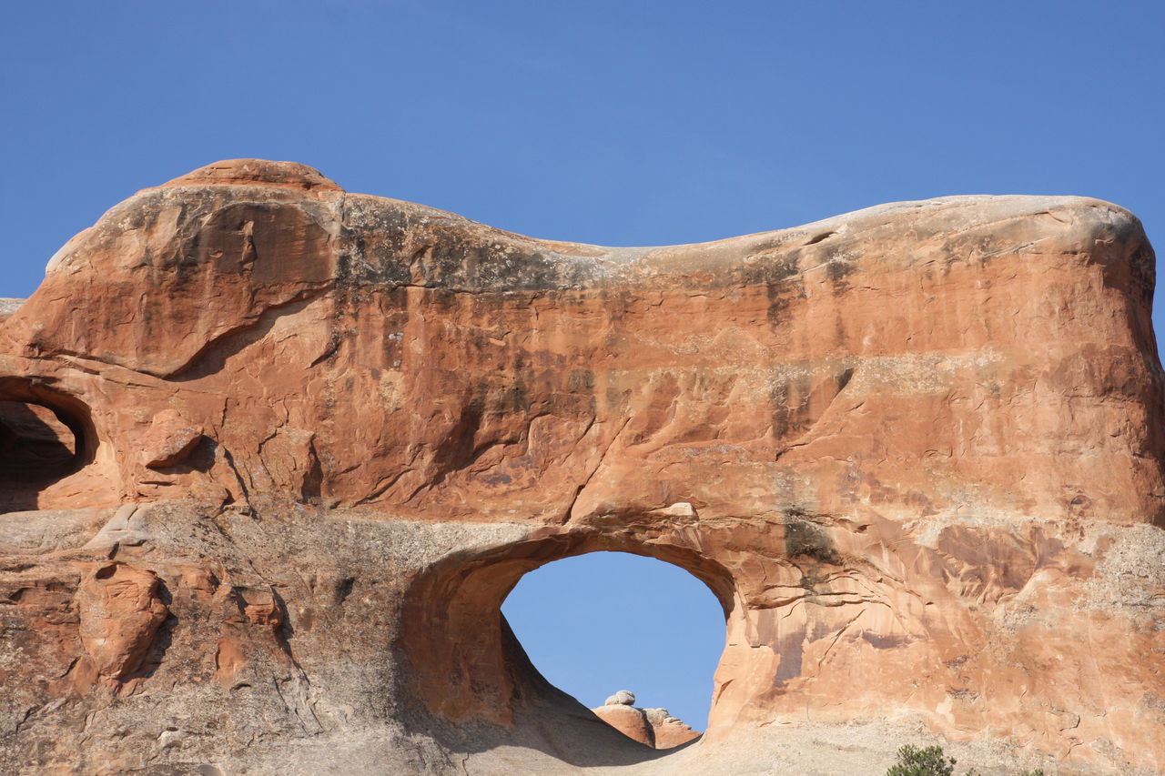 LOW ANGLE VIEW OF ROCK FORMATIONS