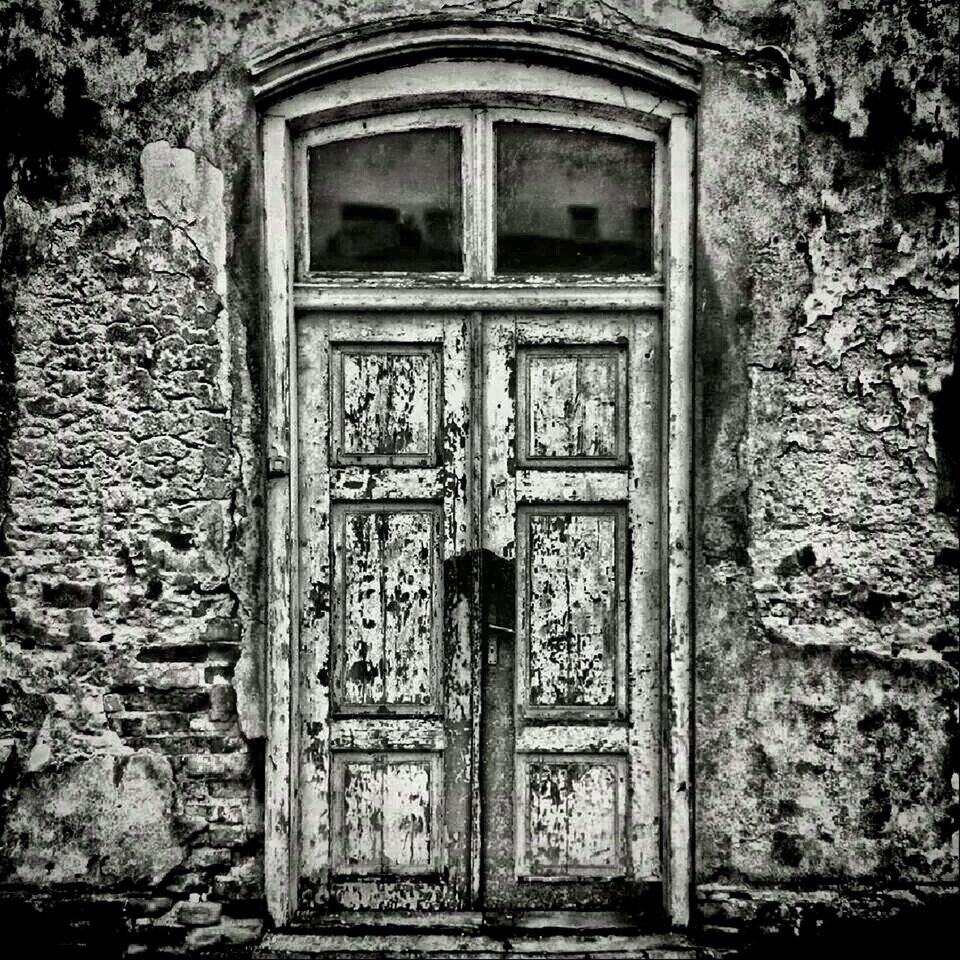 CLOSED DOOR OF OLD BUILDING