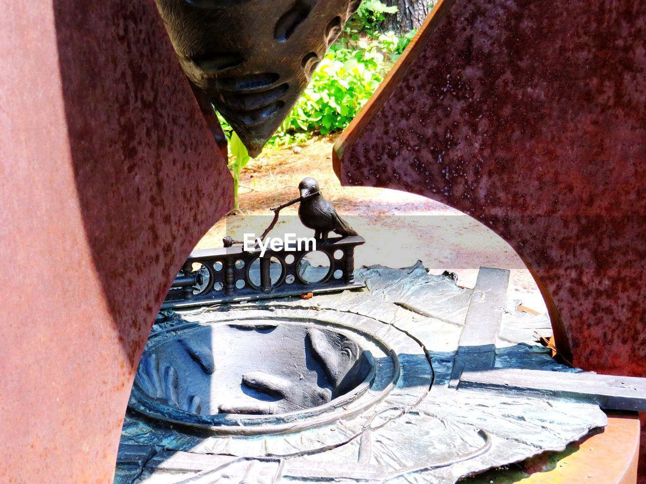 HIGH ANGLE VIEW OF GRAFFITI ON WALL BY BUILDING