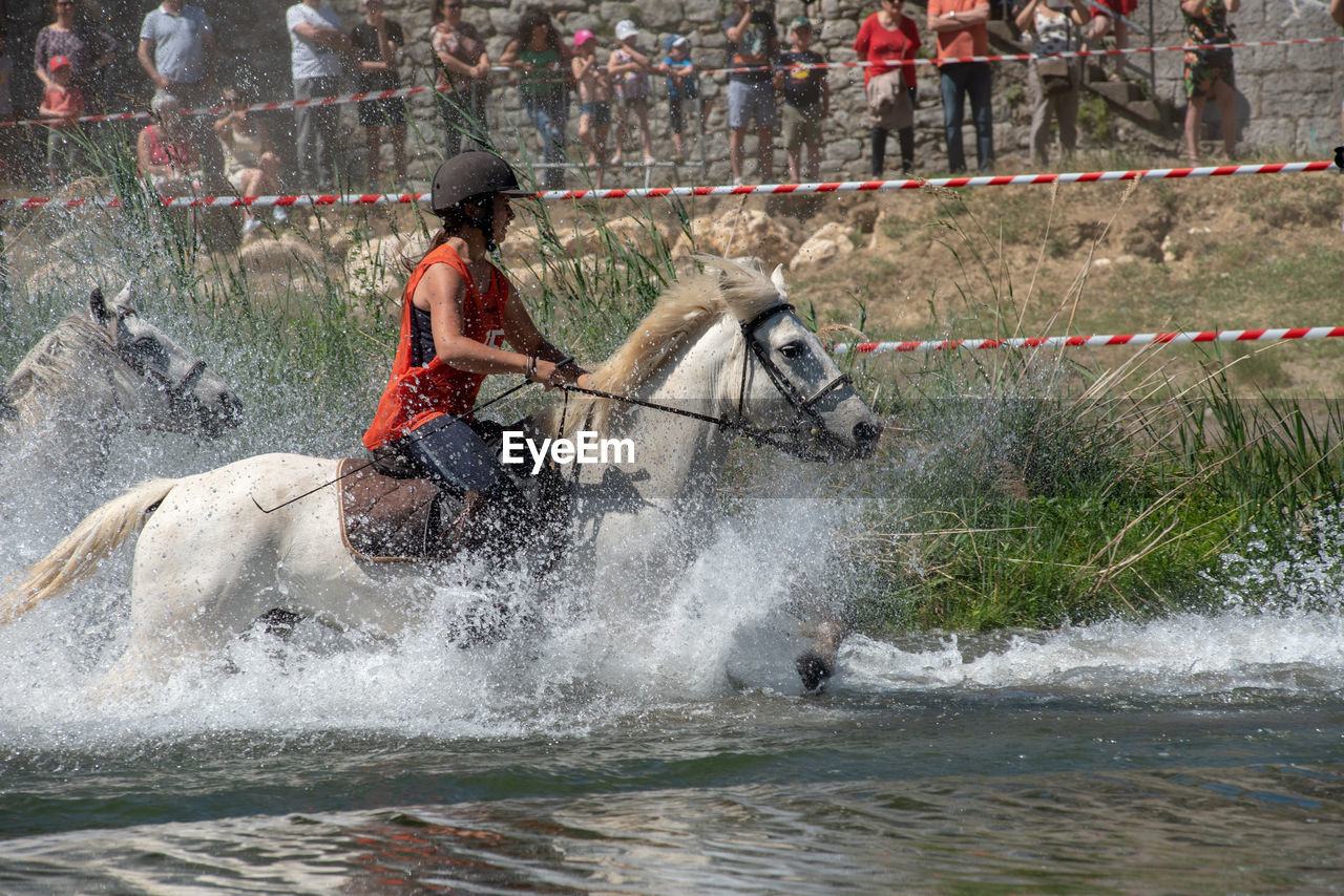 VIEW OF PEOPLE ENJOYING ON RIVER