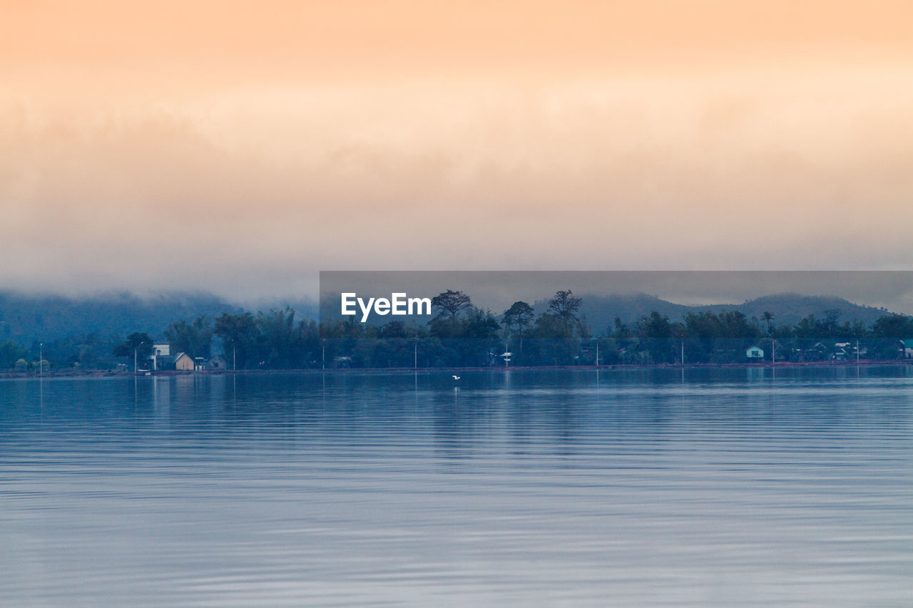 SCENIC VIEW OF LAKE DURING SUNSET