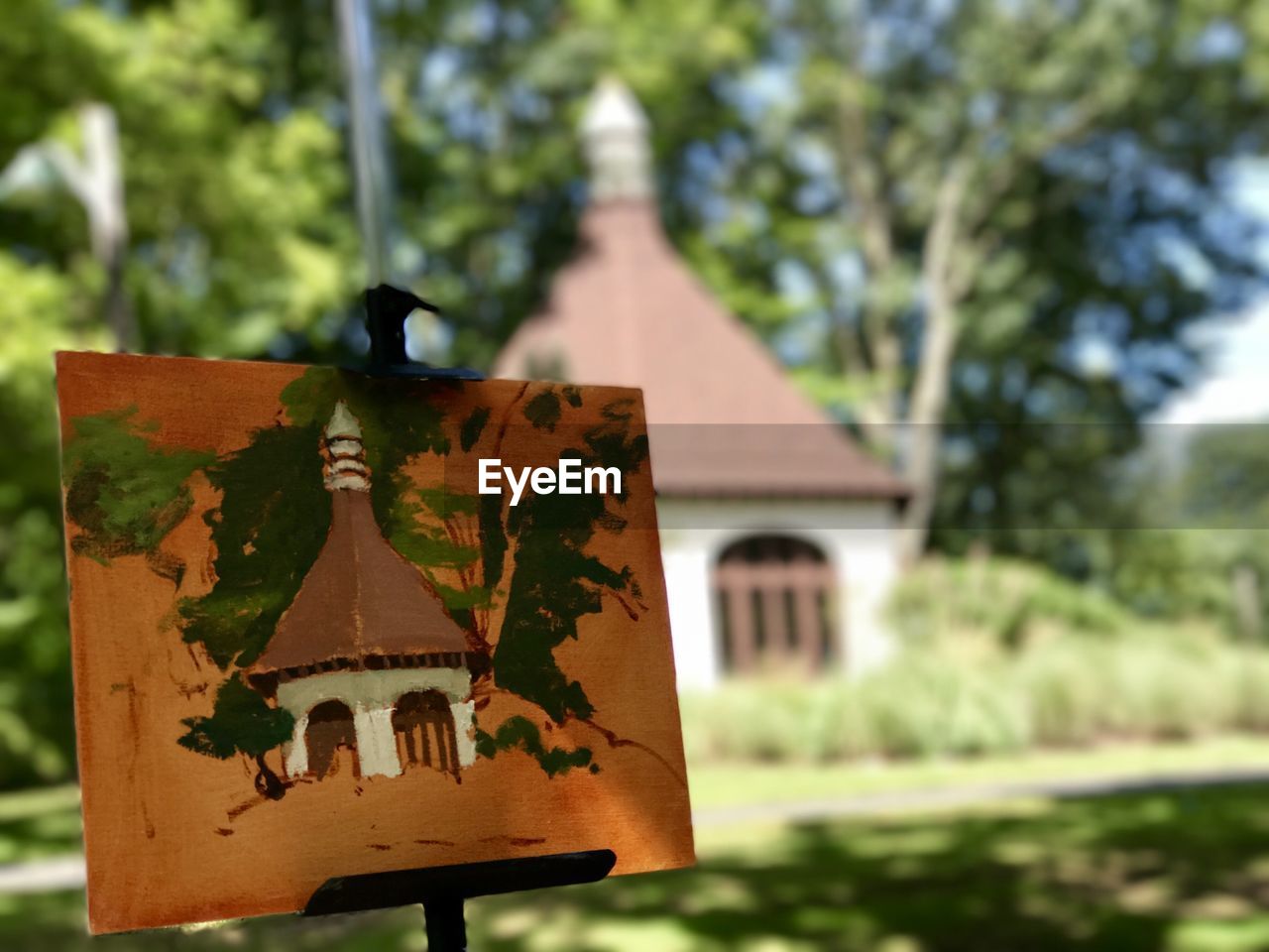 CLOSE-UP OF INFORMATION SIGN AGAINST TREES