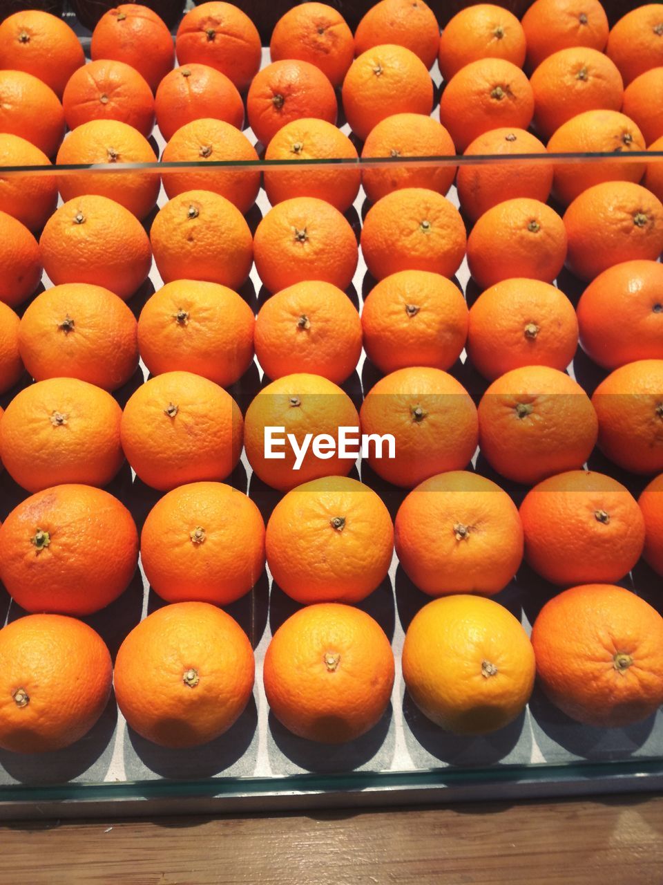 CLOSE-UP OF ORANGES IN ORANGE