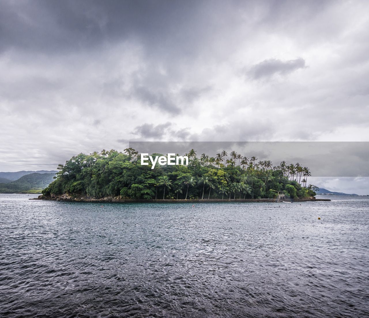SCENIC VIEW OF ISLAND AGAINST SKY