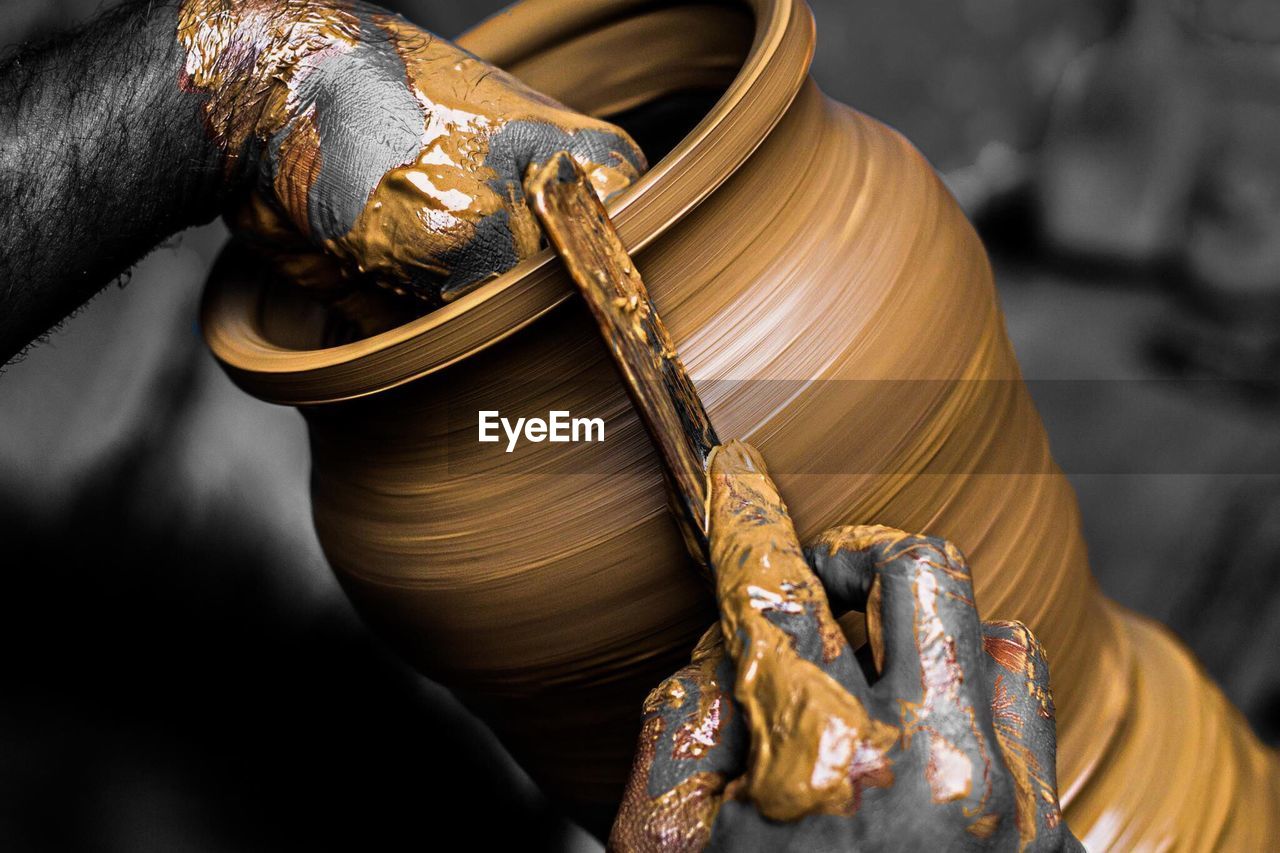 Close-up of sculptor making pot