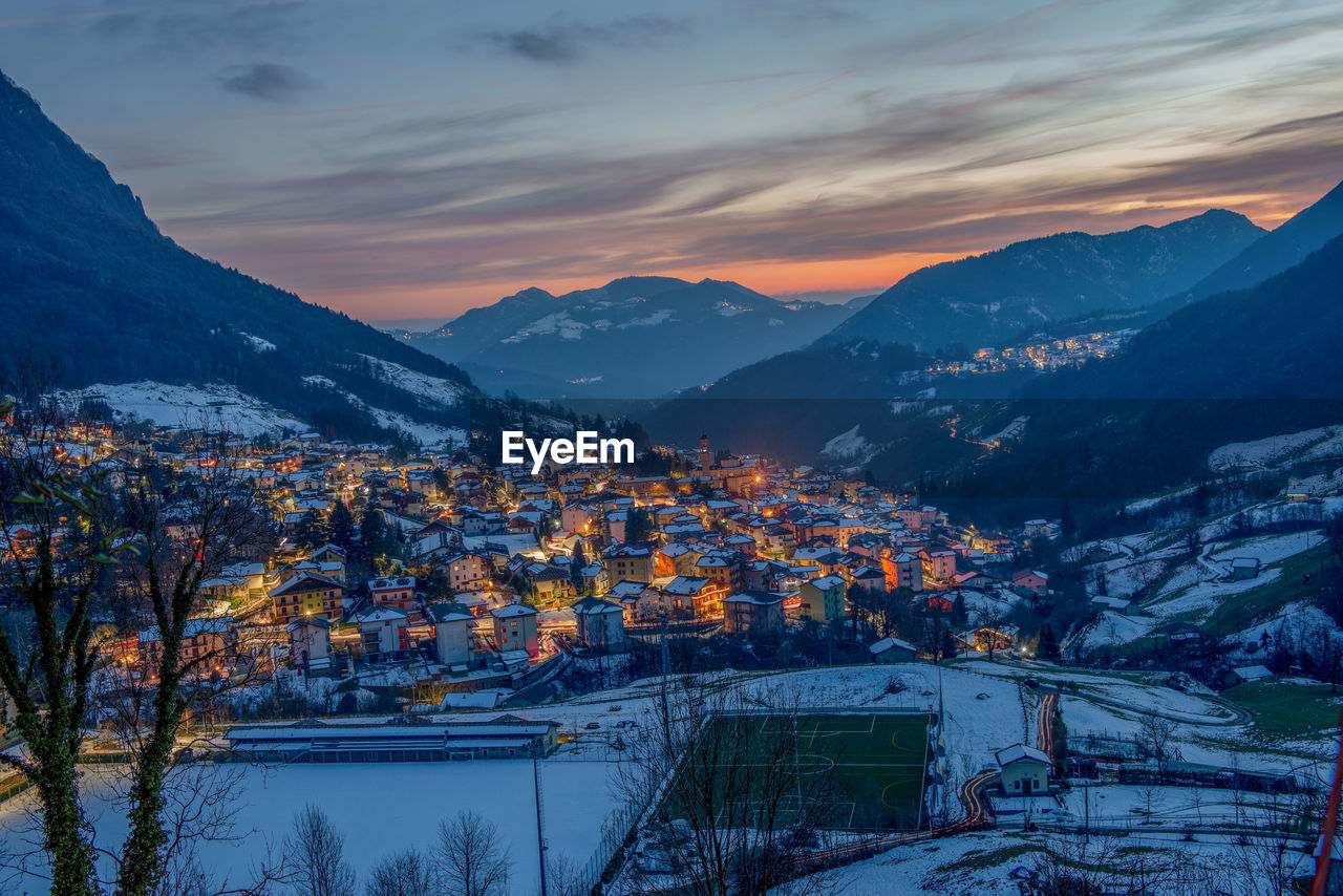 Aerial view of townscape against sky during sunset
