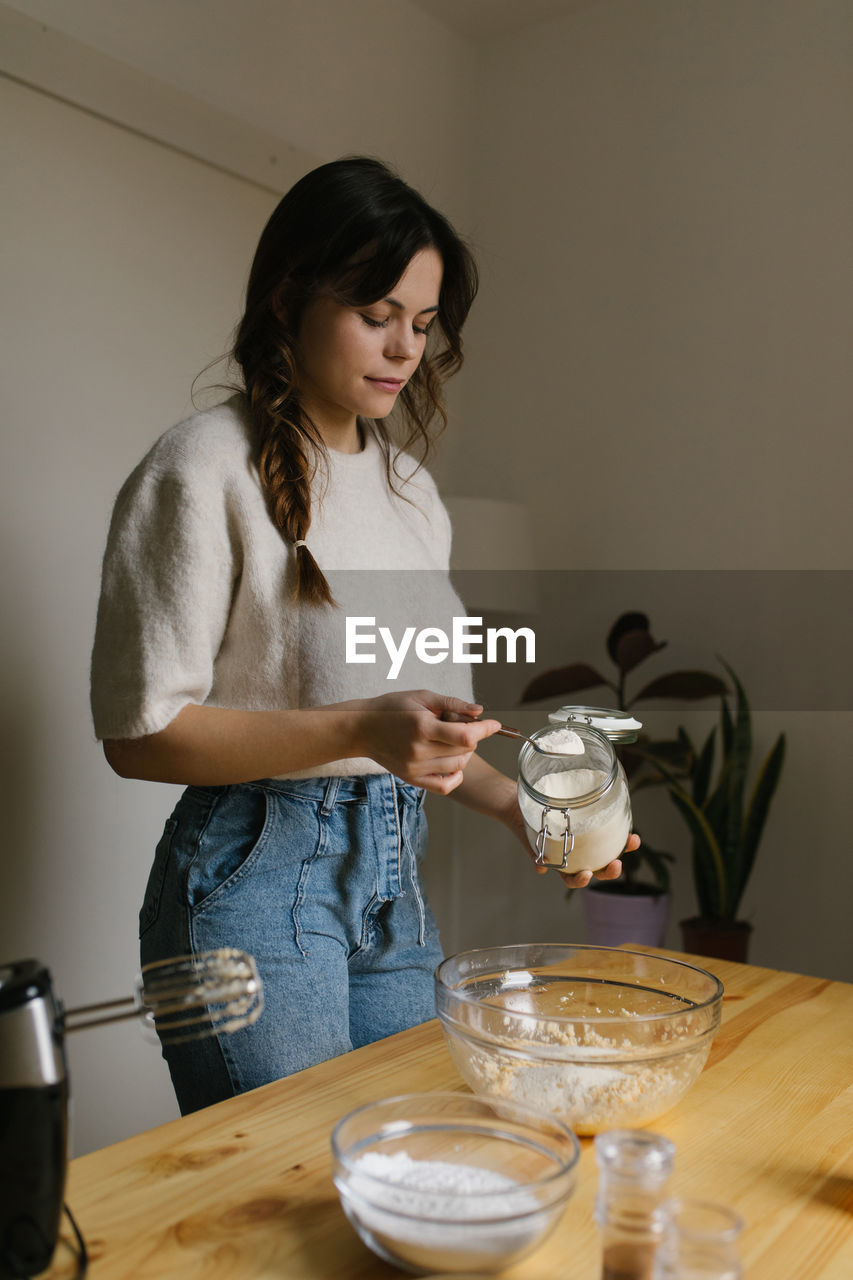 Young woman making christmas cookies