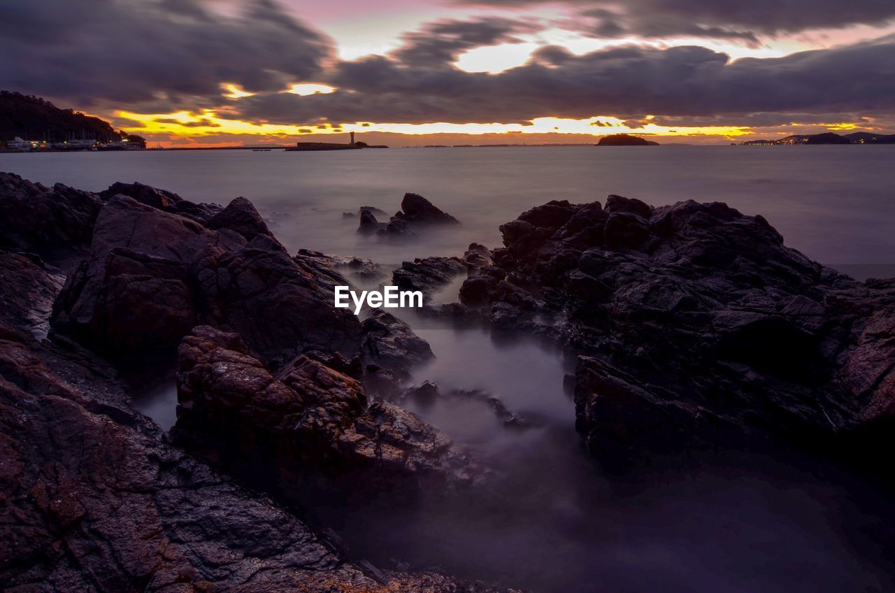 Scenic view of sea against sky at sunset