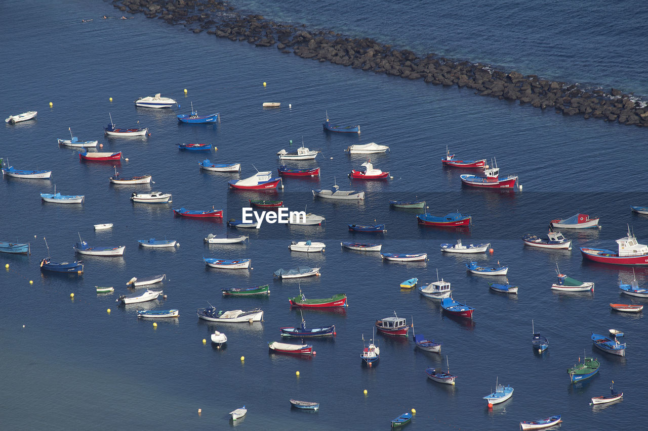 High angle view of boats moored in sea