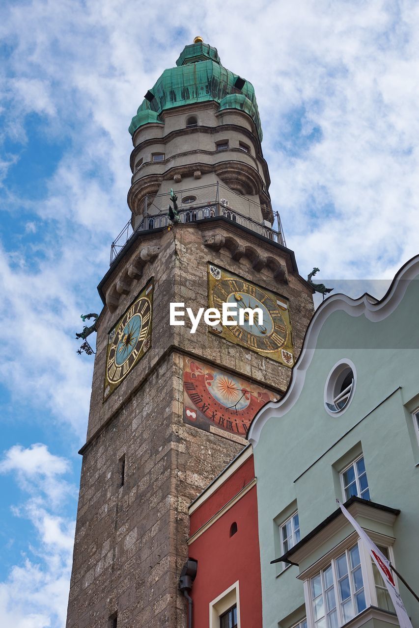 Low angle view of clock tower against sky