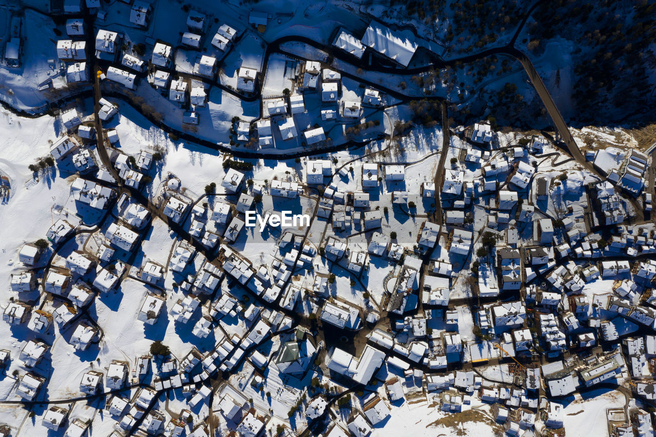 HIGH ANGLE VIEW OF SNOW COVERED BARE TREES