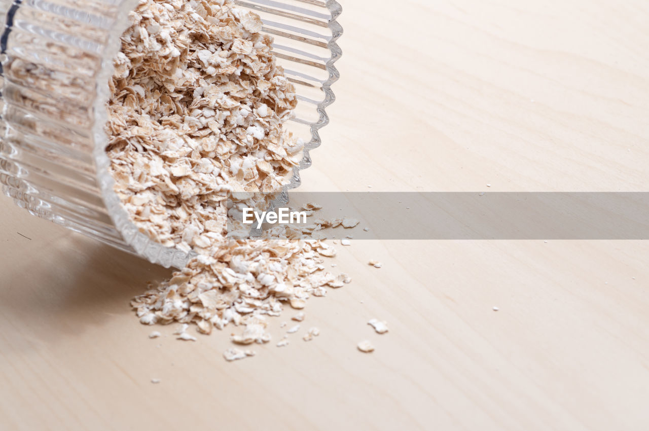 CLOSE-UP OF BREAD ON WOODEN TABLE