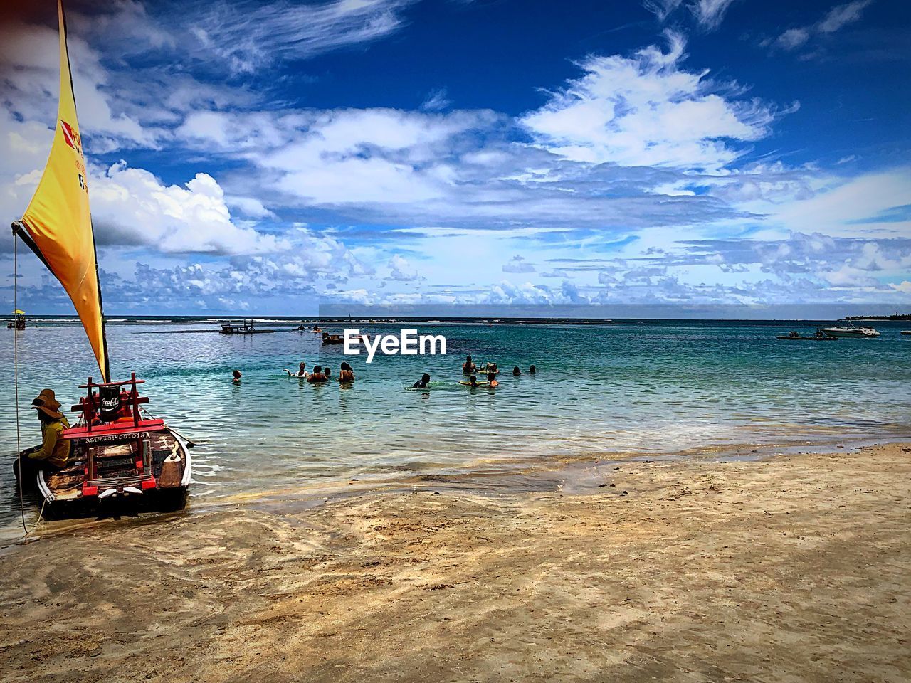 GROUP OF PEOPLE ON BEACH