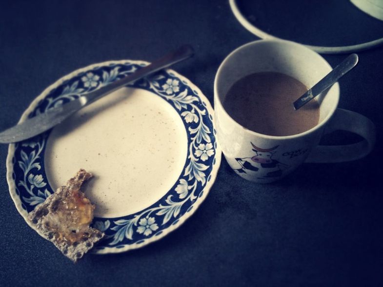 CLOSE-UP OF COFFEE CUP WITH SPOON