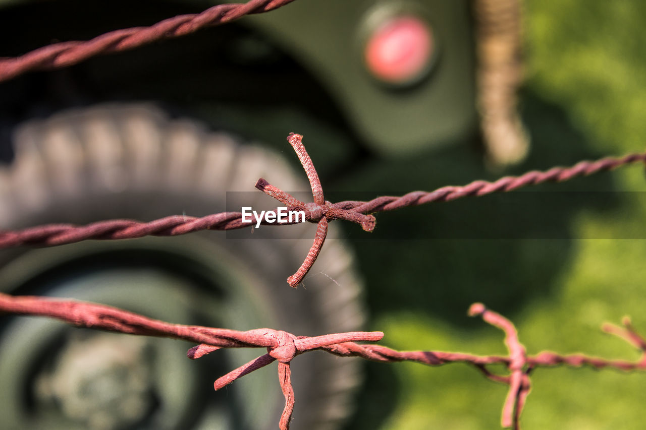 CLOSE-UP OF A BARBED WIRE