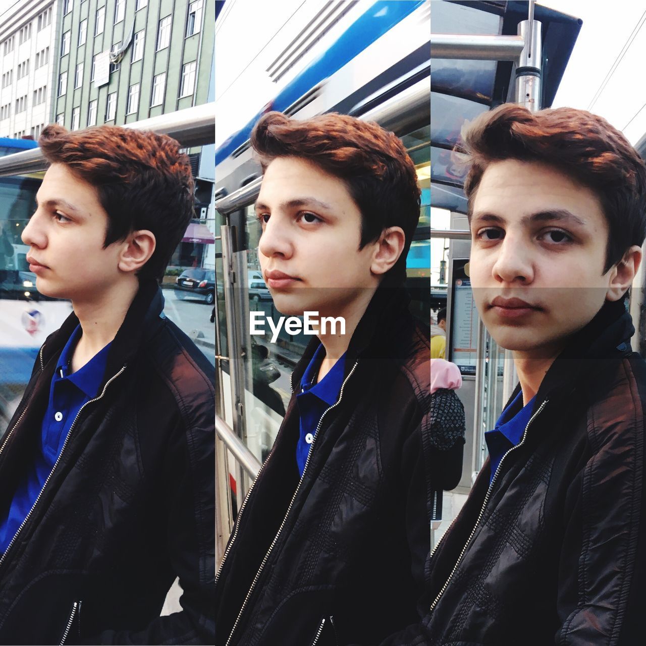 PORTRAIT OF YOUNG MAN LOOKING AWAY IN BUS