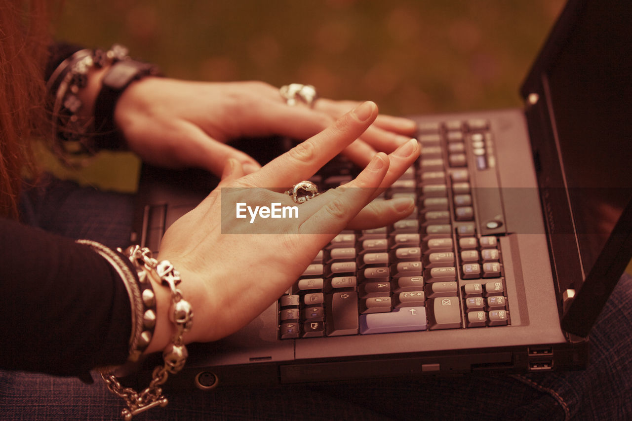 Close-up of woman working on laptop