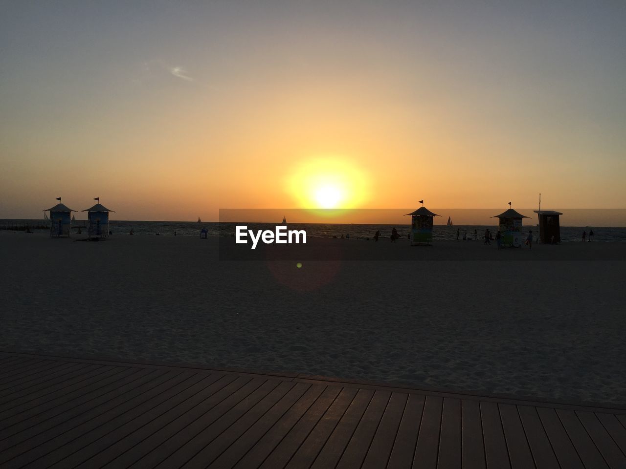 SCENIC VIEW OF BEACH DURING SUNSET