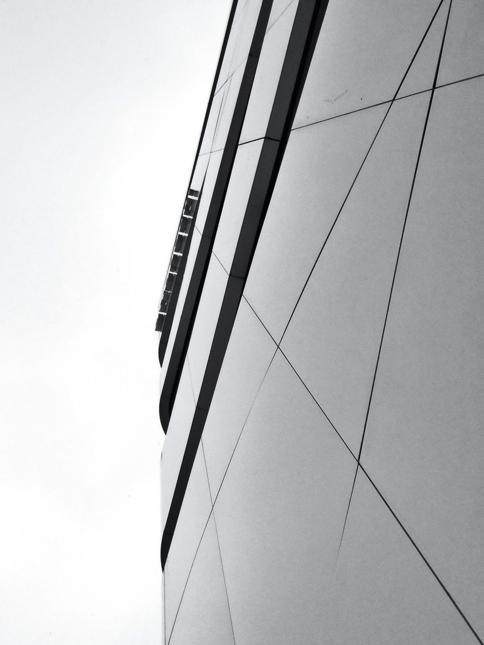 Low angle view of tall building against clear sky