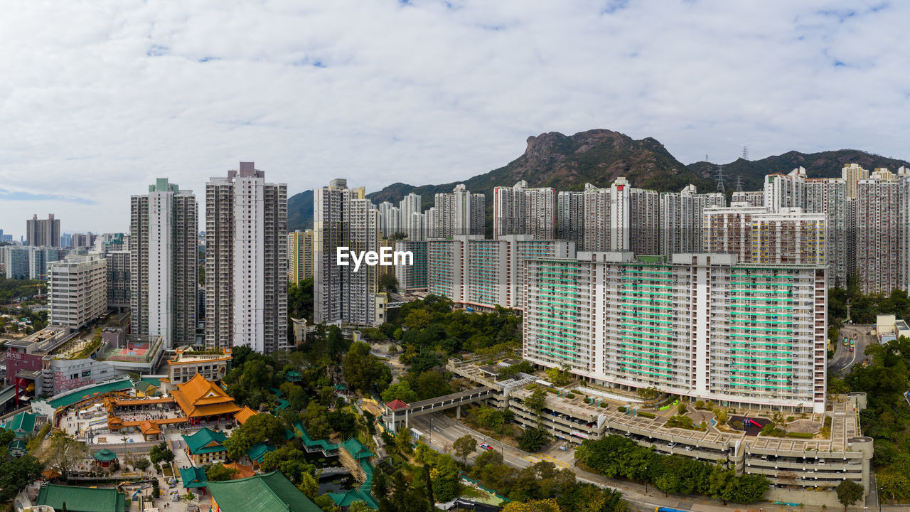 high angle view of buildings in city against sky