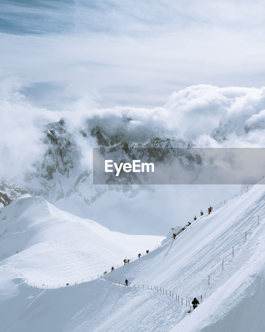 Scenic view of snow covered mountains against sky