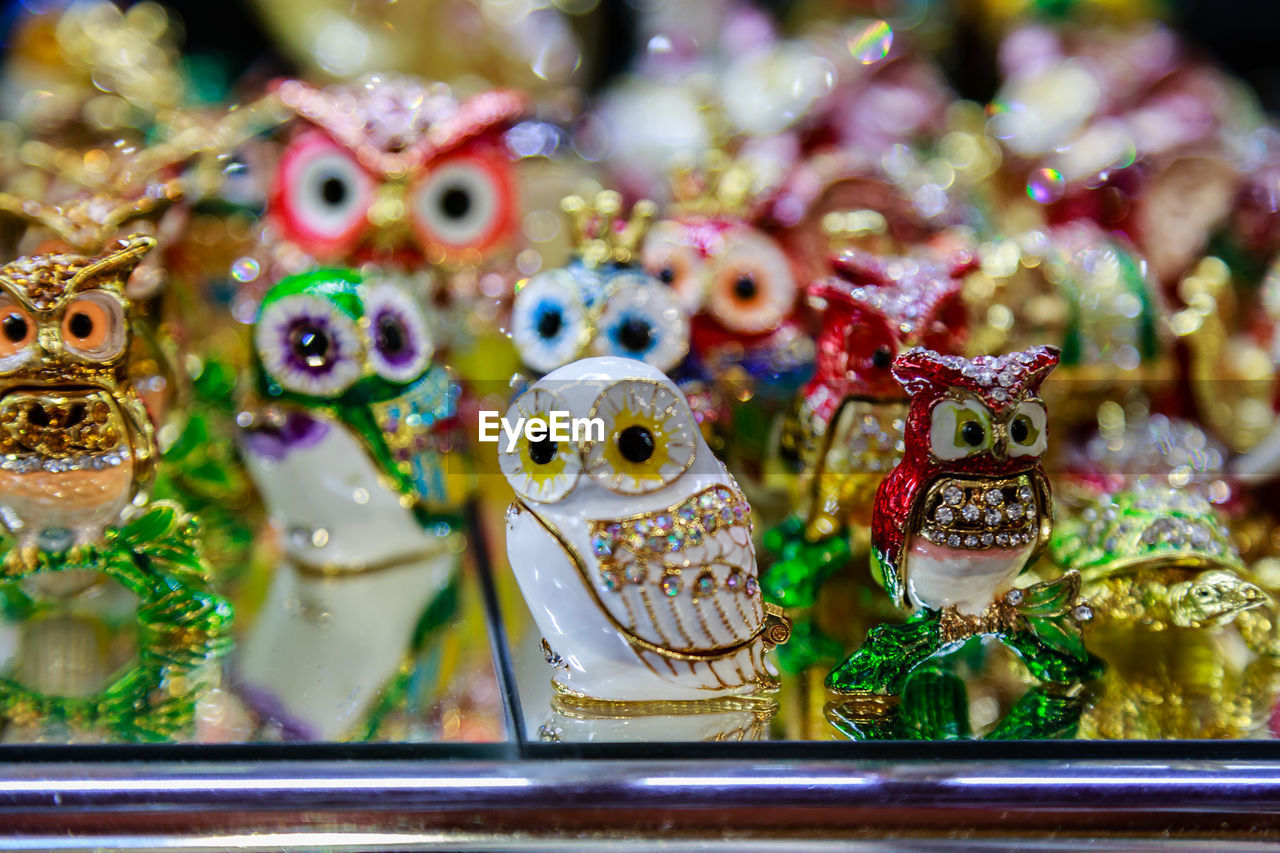 no people, representation, animal representation, retail, close-up, craft, figurine, for sale, market, celebration, indoors, animal, multi colored, holiday, creativity, selective focus, animal themes, focus on foreground, tradition, decoration, variation, still life