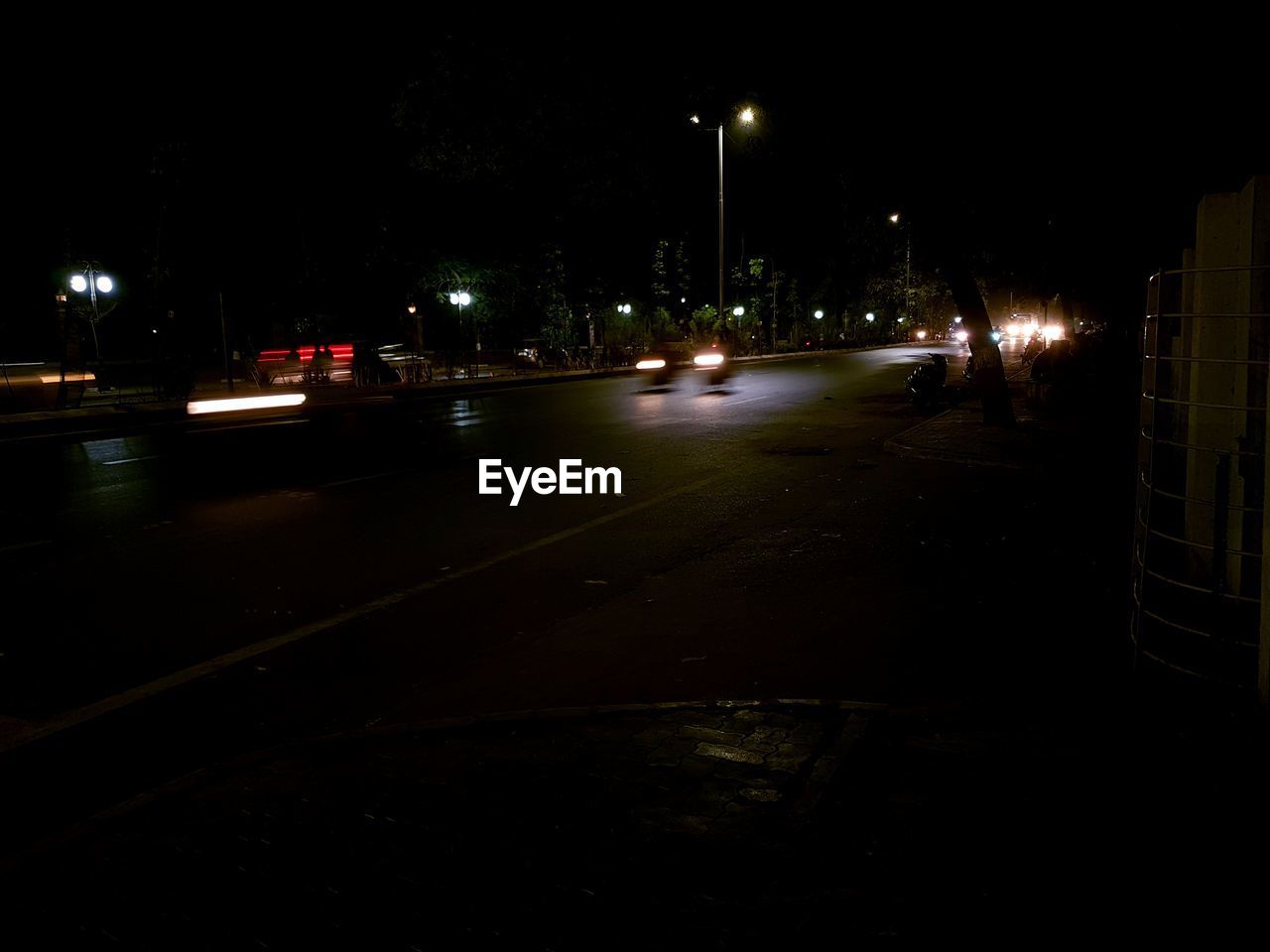 CARS ON STREET AT NIGHT