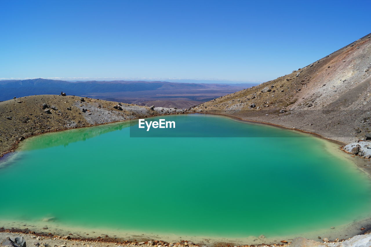 Scenic view of lake against blue sky