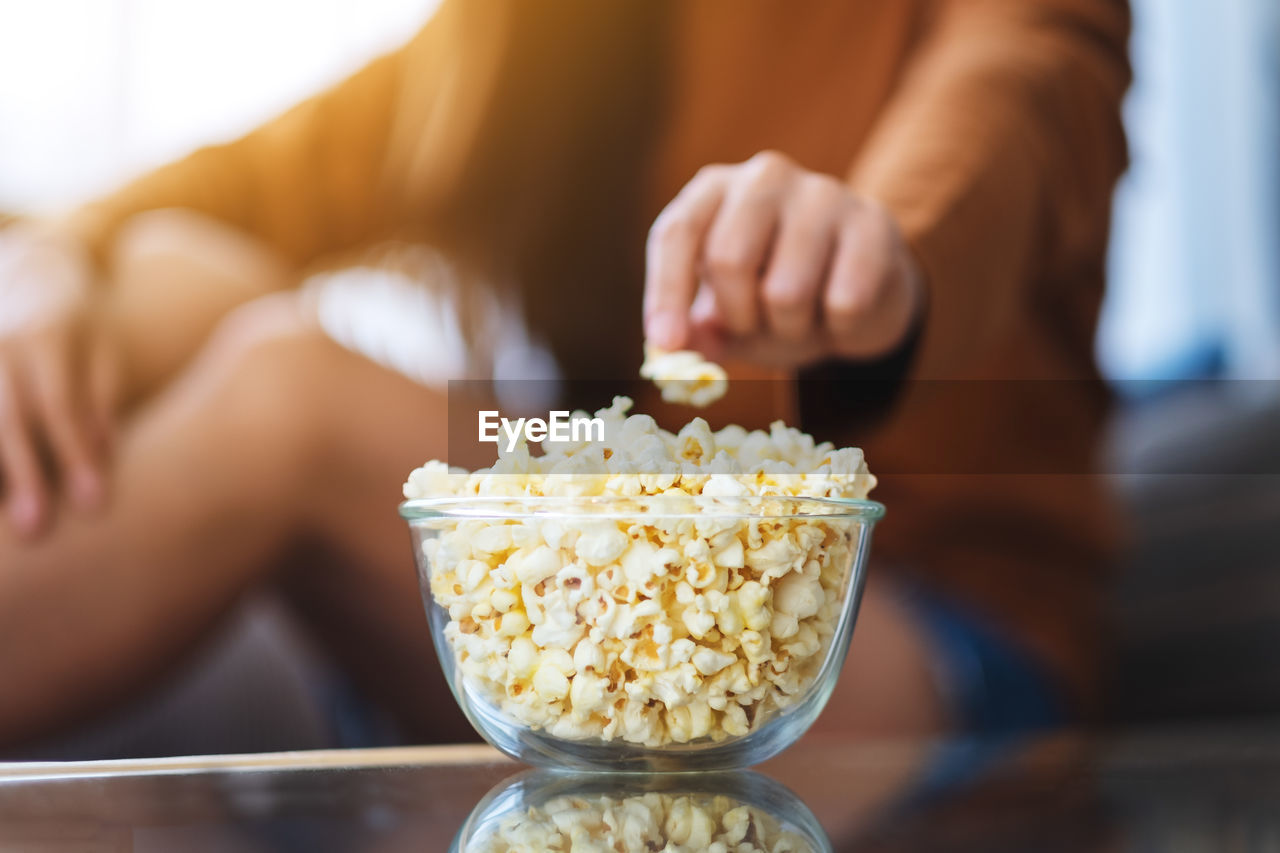 midsection of woman holding food