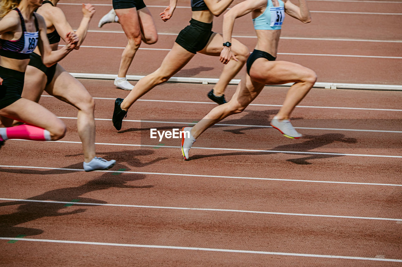 low section of woman exercising on floor