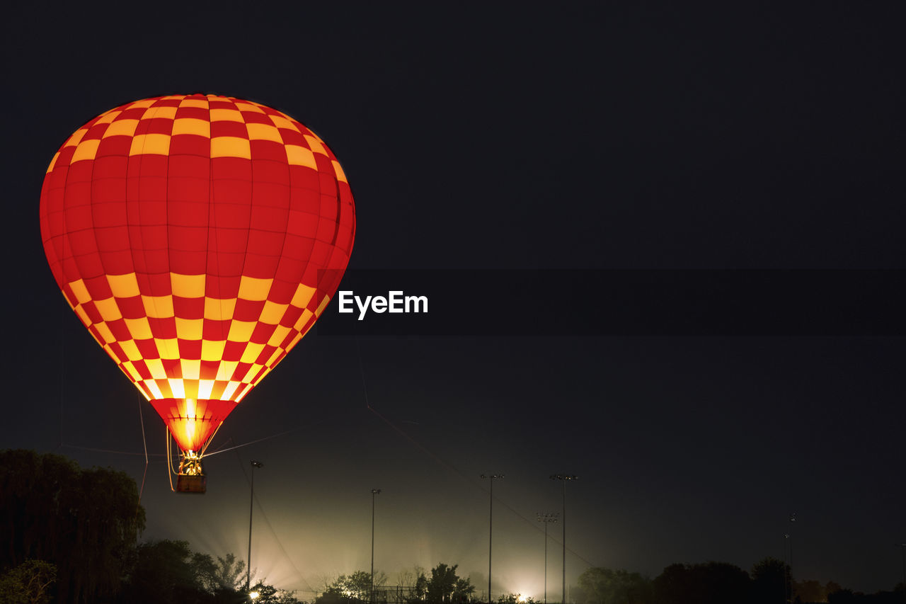 LOW ANGLE VIEW OF STREET LIGHT AT NIGHT