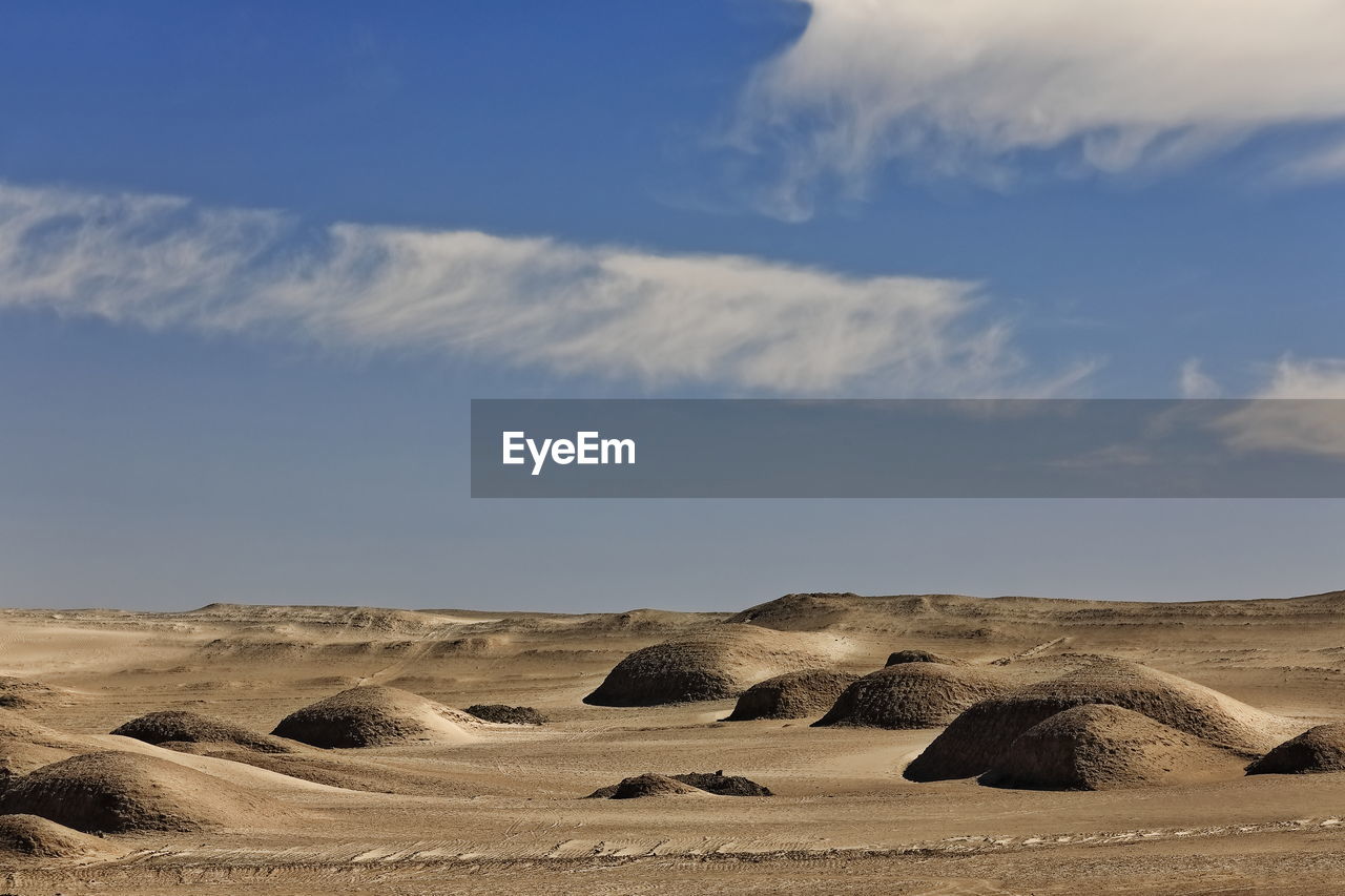 PANORAMIC VIEW OF DESERT AGAINST SKY