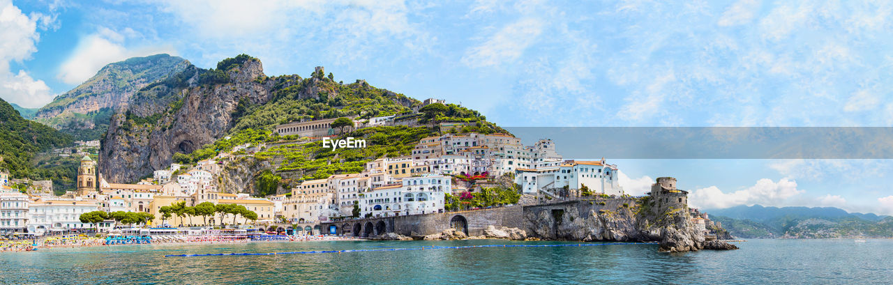 Panoramic view, aerial skyline of small haven of amalfi village with tiny beach, campania, italy