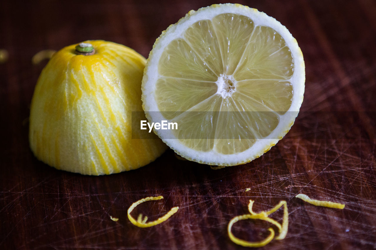 High angle close-up of lemon on wooden table