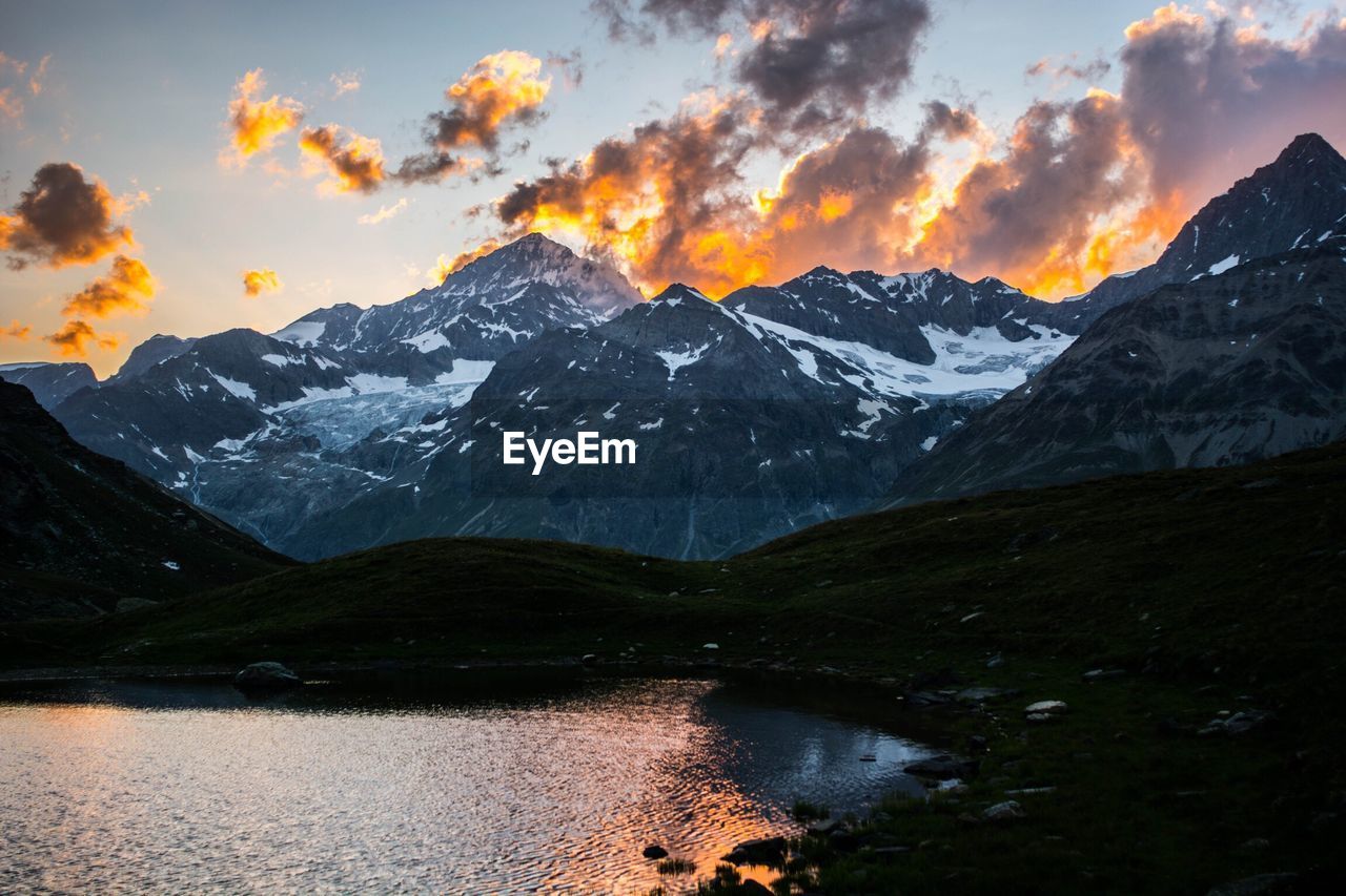 Scenic view of mountains against sky during sunset