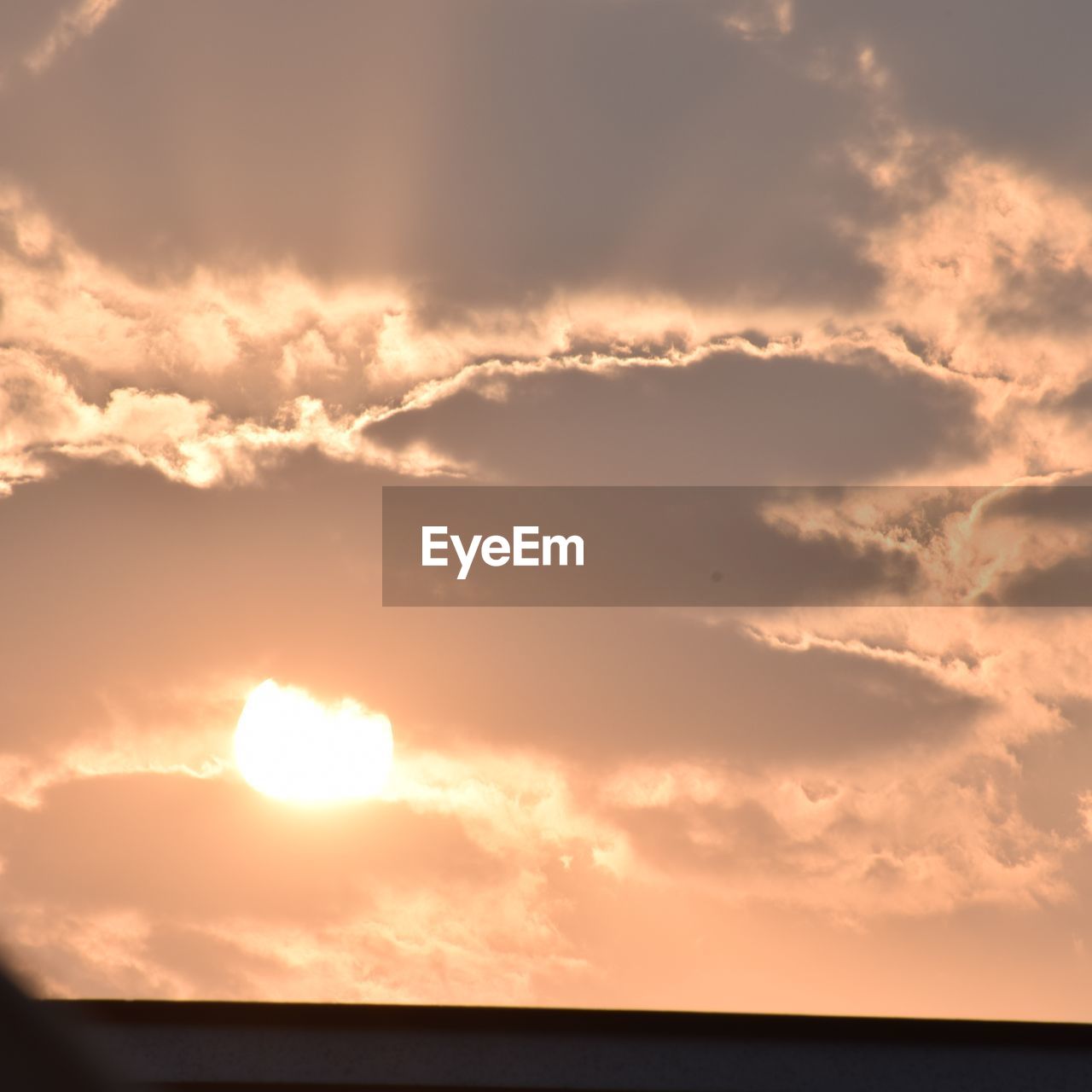 LOW ANGLE VIEW OF CLOUDS OVER SEA DURING SUNSET