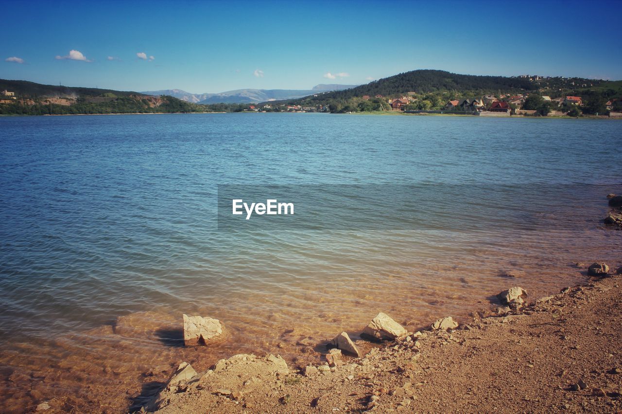 Scenic view of sea against blue sky