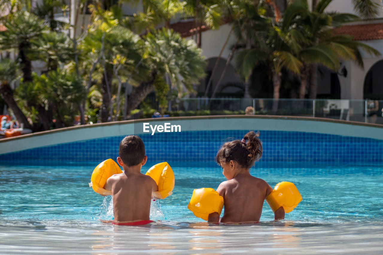 People enjoying in swimming pool