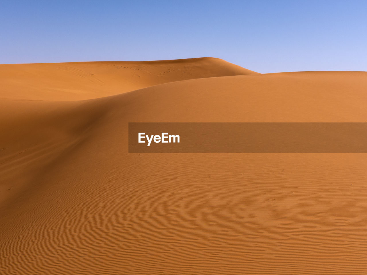 Scenic view of desert against clear sky