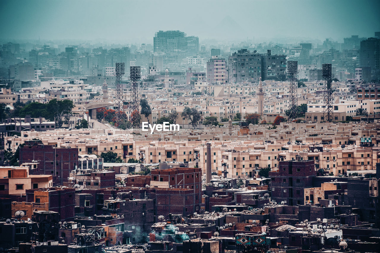 Scenic view of town against clear sky