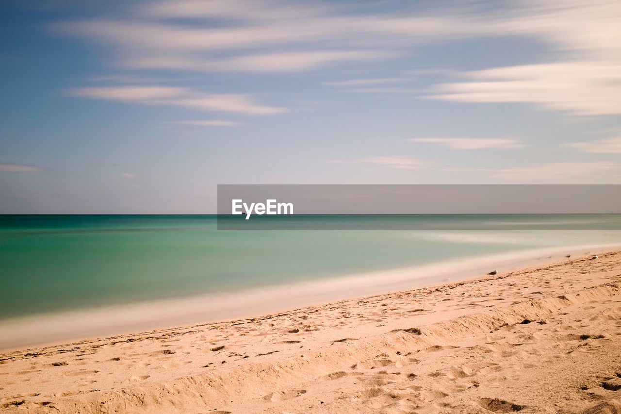 Scenic view of sea against sky at sunset