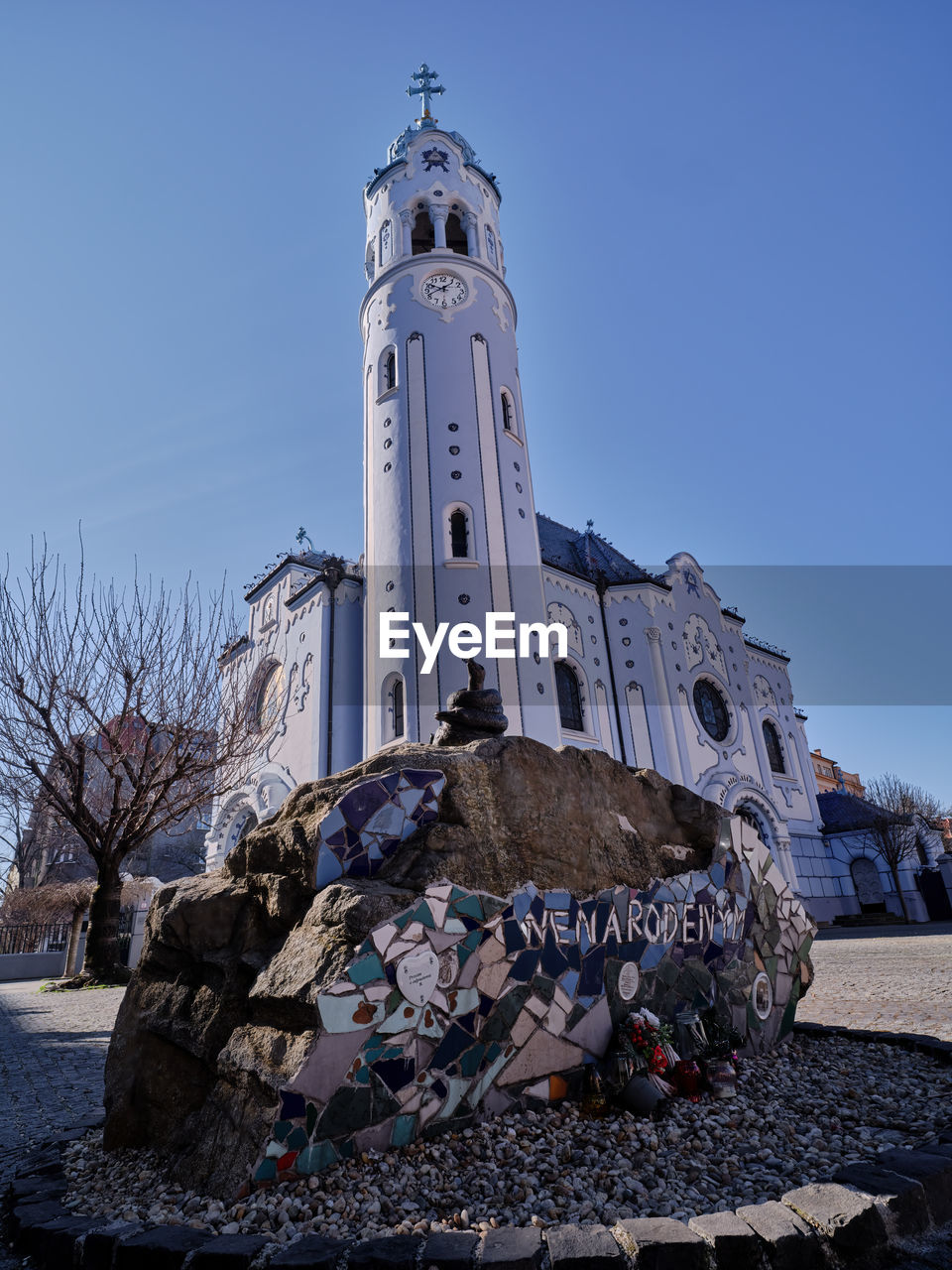 Rock as a memorial to unborn children and Church of St. Elizabeth , commonly known as Blue Church in Bratislava, Slovakia Memorial Unborn Rock Stones Church Blue Tower High Low Angle View Sky Religion Background Outdoors