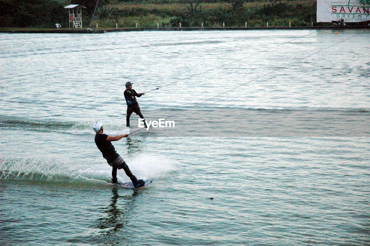MAN SURFING ON WATER