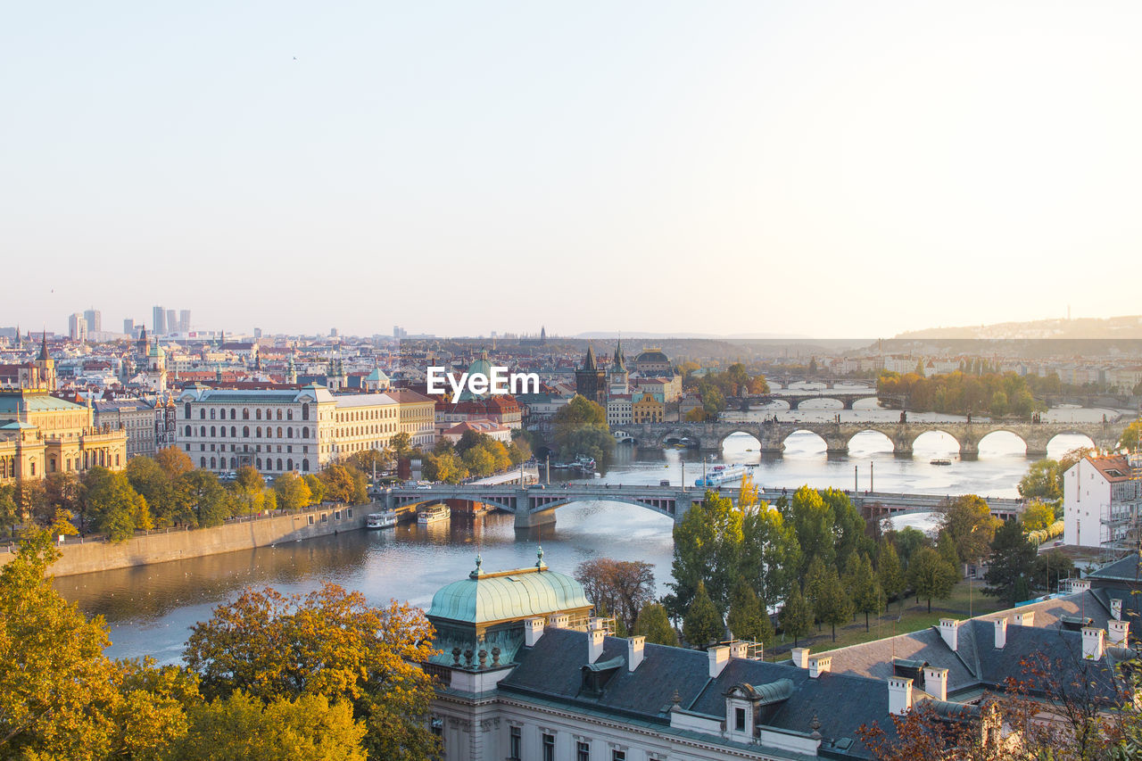 High angle view of bridge over river in city against clear sky