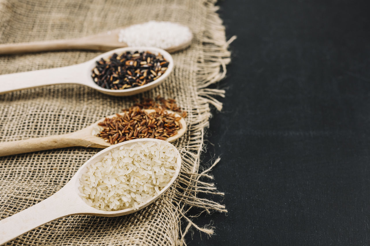 food and drink, food, studio shot, indoors, kitchen utensil, spoon, ingredient, wellbeing, eating utensil, wood, spice, no people, healthy eating, plant, seed, still life, freshness, dry, cereal plant, herb, organic, close-up, wooden spoon, dried food, high angle view, variation, table