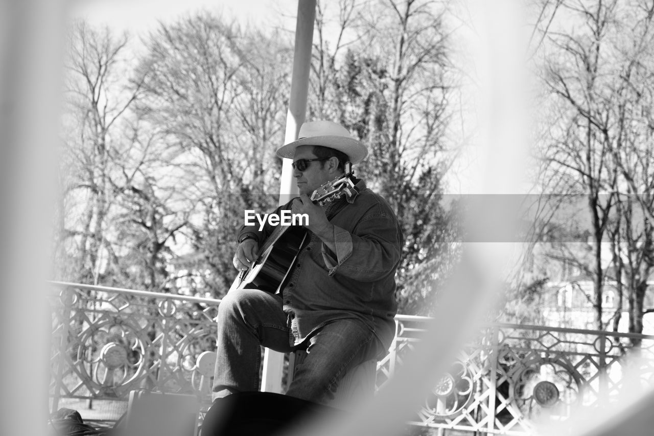 Low angle view of man playing guitar